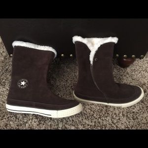 Brown Converse ankle boots lined with white fur.